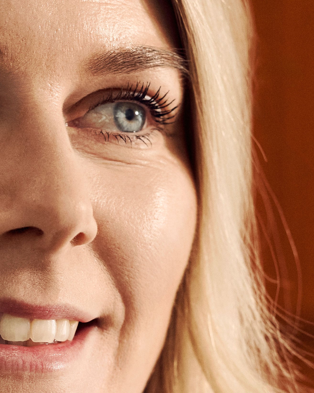 Woman with blonde hair and blue eyes in profile view